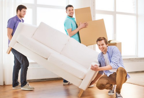 Organised storage unit interior with packed boxes and labelled containers