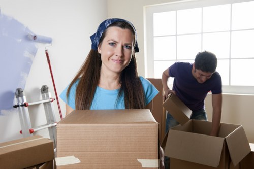 Experienced packers organising fragile items in Kilburn