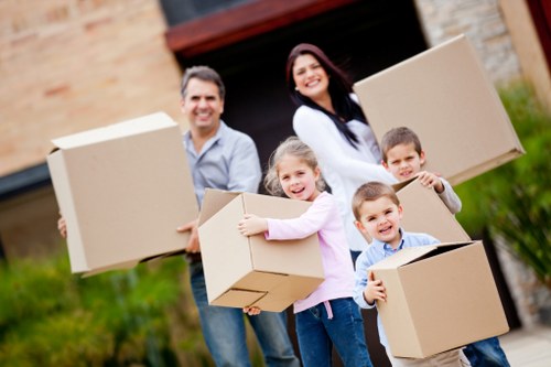 Students arranging boxes for storage in Kilburn