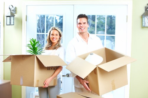 A removal team loading items for a Kilburn small move