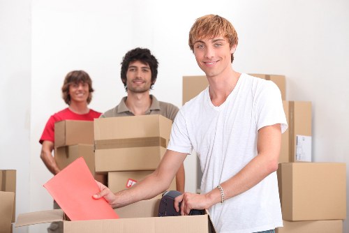 Packed moving boxes and furniture for a Kilburn relocation